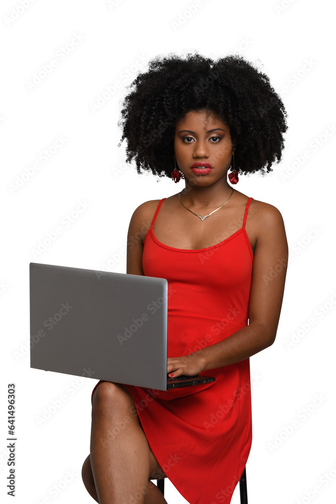 woman with laptop typing on keyboard and looking at camera, black woman woman with laptop typing on keyboard and looking at camera, black woman