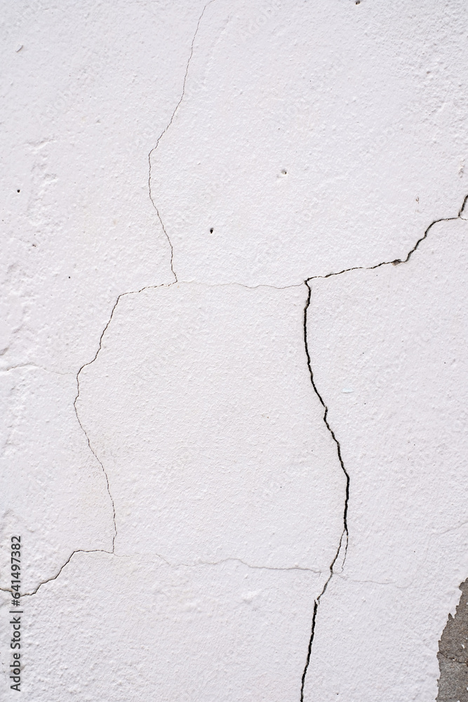 Close-up of Cracked concrete wall texture, Cement background not painted in vintage style for graphic design or retro wallpaper,texture crack in concrete wall Close-up of Cracked concrete wall texture, Cement background not painted in vintage style for graphic design or retro wallpaper,texture crack in concrete wall