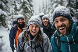 Diverse group of people and friends hiking together in the forests and mountains during winter and snow
