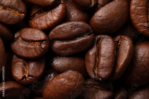 Aromatic roasted coffee beans as background, top view