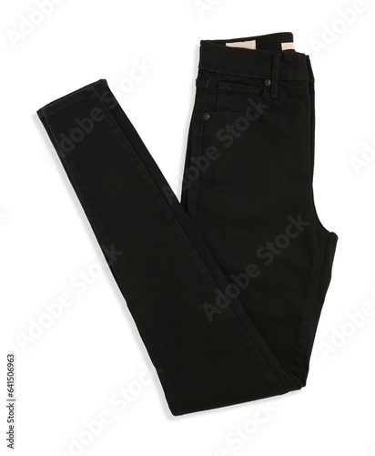 Folded black jeans isolated on white, top view