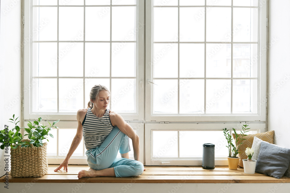 Yoga practice on window sill Yoga practice on window sill