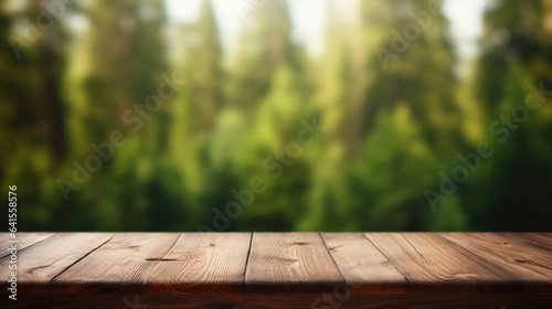 Empty wooden table top with blur background of forest