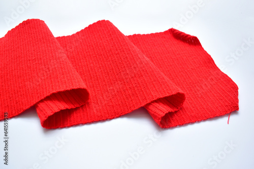 wavy of red wool knitted yarn texture, woolen fabric on white background