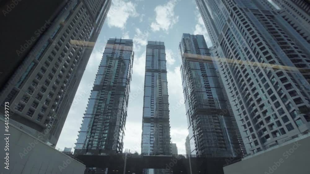 modern Dubai skyscrapers outside the tram window modern Dubai skyscrapers outside the tram window