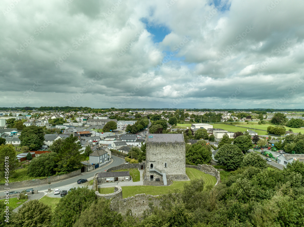 Aerial view of Athenry castle tower house dramatic three-storey hall-keep survives from the mid-thirteenth century, large, rectangular building with gabled roof and medieval walled town and priory in 