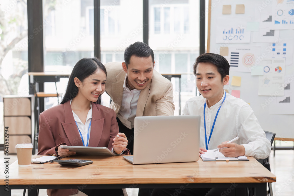 Three business people are enjoying teamwork and sharing work ideas. Three business people are enjoying teamwork and sharing work ideas.
