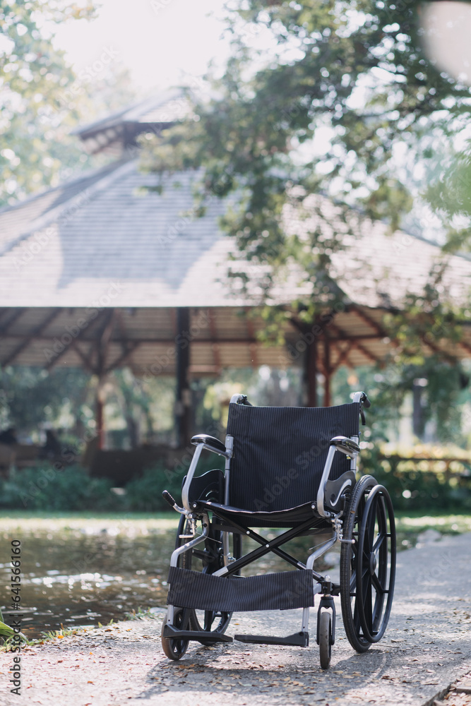 Obraz premium Asian young woman nurse at nursing home take care disabled senior man. Caregiver doctor serve physical therapy for older elderly patient to exercise and practice walking on walker or cane at backyard.