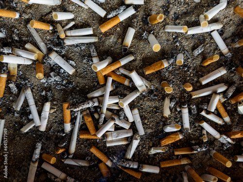 Smoked cigarette butts in the ashtray Nicotine poisoning causes lung cancer, drugs, and pollution. Dirty.