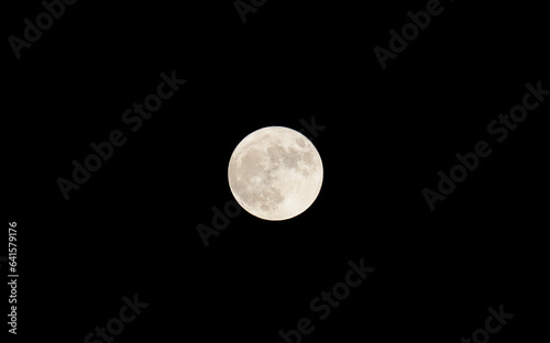 Fotografija Rare super blue moon on the dark sky as seen from San Diego, California USA on August 30, 2023