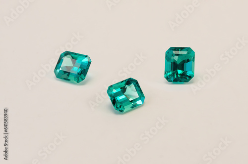 Green emeralds from Muzo, Coscuez and Chivor Colombia, isolated on white background Princess cut jewel Round cut jewel Emerald cut jewel Oval jewel, Colorful green gemstones photo