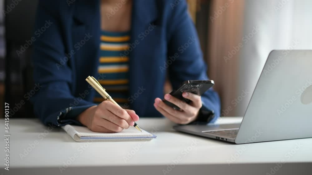 business hand working with new modern computer and writing on the notepad strategy diagram as concept business hand working with new modern computer and writing on the notepad strategy diagram as concept