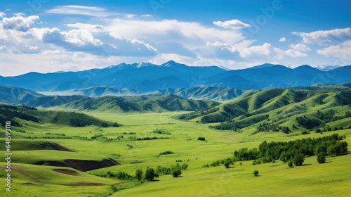 Sweeping vista landscape of the Assy Plateau, a large mountain steppe valley and summer pasture 100km from Almaty, Kazakhstan.