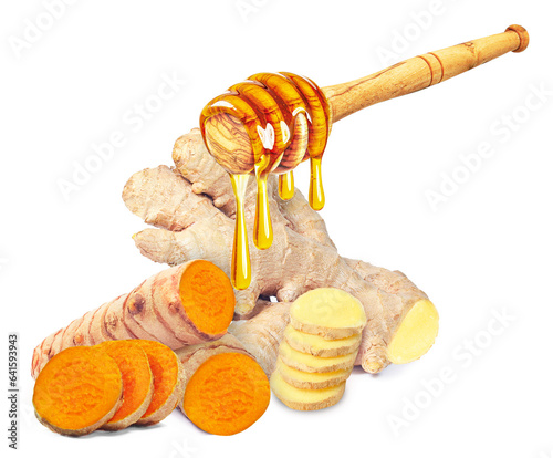dripping honey on turmeric root and ginger isolated on white background