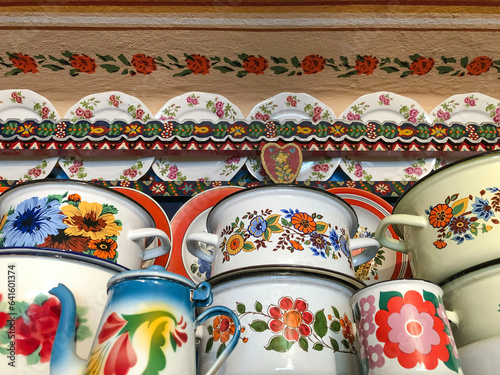 hand painted enamel saucepans plates, and pots