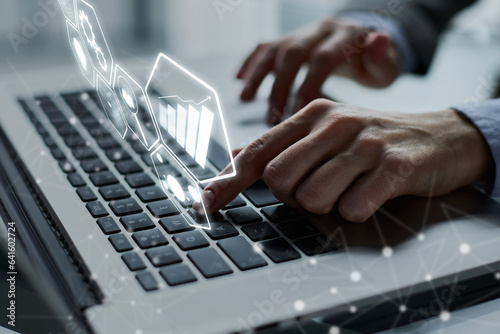 Close-up of male hands using laptop at office