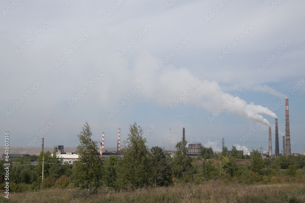 Environmental pollution. Smoke from the pipe of an industrial factory