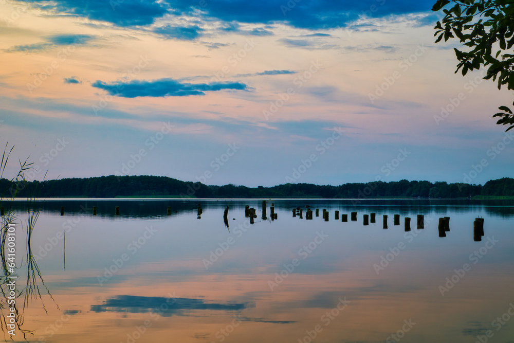 Fototapeta premium See - Wasser - Abend - Sunset - Landscape - Beautiful - silhouette - Sunrise Sea - Colorful - Reed - Clouds - Sky - Sundown - Sun 
