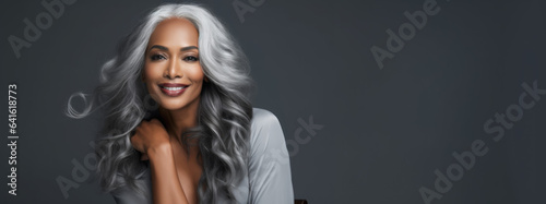 Gorgeous Black Woman Flaunting Youthful, Smooth Skin. Lovely Mature Lady Sporting Long, Silver Hair and a Beaming Smile.