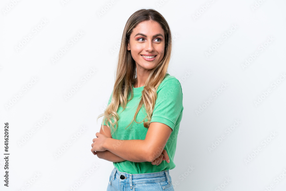 Obraz premium Young Uruguayan woman isolated on white background looking to the side and smiling
