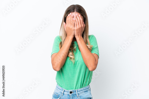 Young Uruguayan woman isolated on white background covering eyes by hands