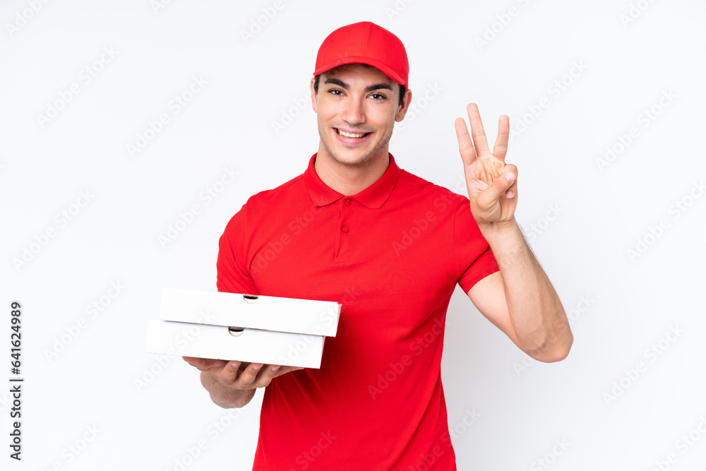 Pizza delivery caucasian man with work uniform picking up pizza boxes isolated on white background happy and counting three with fingers Pizza delivery caucasian man with work uniform picking up pizza boxes isolated on white background happy and counting three with fingers