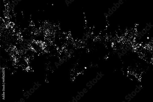 Abstract wavy stream of silver confetti on a black background. Festive design element.