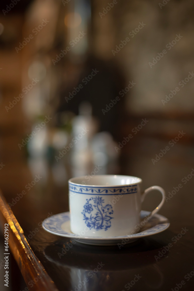 Fototapeta premium A cup of aromatic coffee in a white cup in a cafe on a table