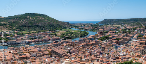 Captured from the vantage point of Castello Malaspina, this panoramic image offers a sweeping view of the Sardinian town of Boza, extending all the way to the sea. 