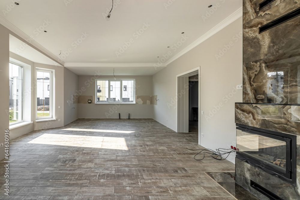 View of the large living room with fireplace immediately after renovation View of the large living room with fireplace immediately after renovation