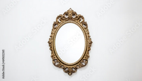 Golden antique mirror against a white wall background texture