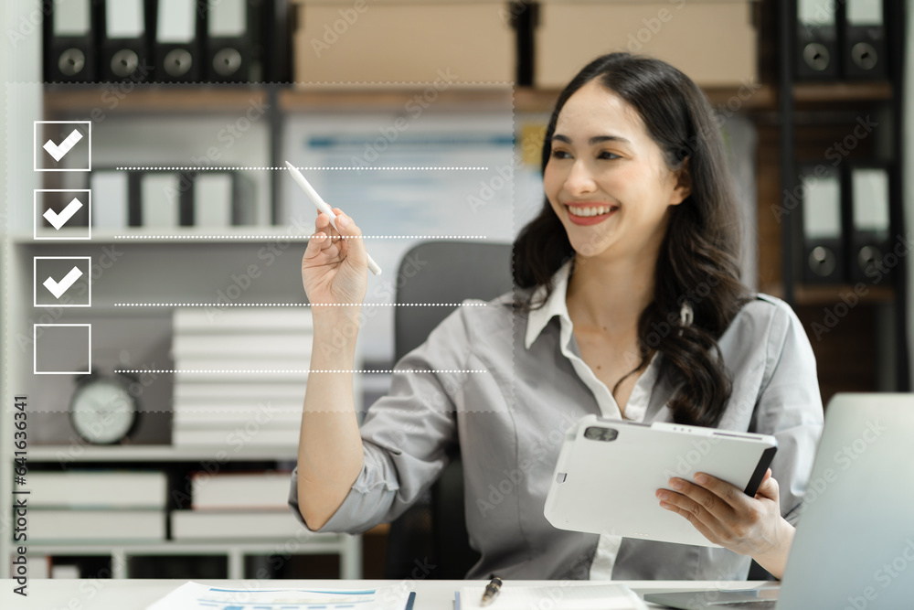 Business performance checklist concept, business woman using tablet and laptop doing online checklist survey, filling out digital form checklist. Business performance checklist concept, business woman using tablet and laptop doing online checklist survey, filling out digital form checklist.