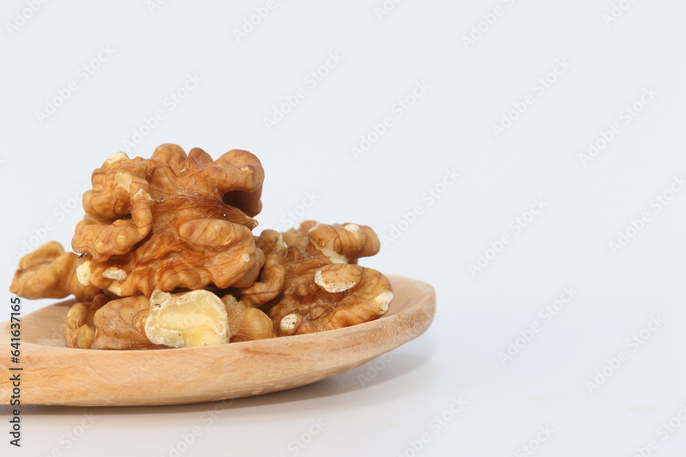 Fototapeta premium walnut kernel and whole walnuts on white background