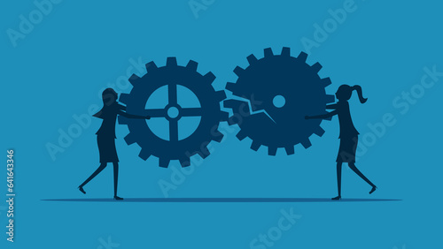 Concepts hinder communication or cooperation. Two businesswomen holding a broken gear mechanism vector photo