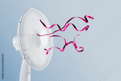 Obraz na plátně Portable electric fan with fluttering ribbons on blue background.