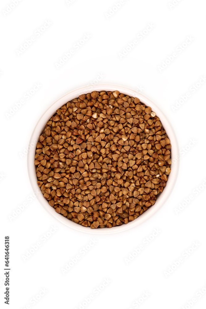 Raw buckwheat heap, isolated on white background.