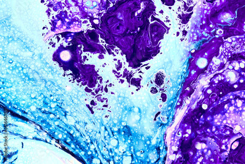 Blue and purple flowing paint texture. Marbled paper abstract background