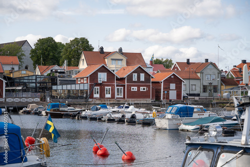 rote Häuser in einer schwedischen Stadt am Wasser, Hafen in Skandinavien photo