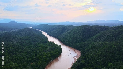Aerial view of Koel river passing through Palamu tiger Reserve at Gotang Forest in Jharkhand. Drone shot neat Maoist forest in Jharkhand, India. Sunset over dense forest with river and dramatic sky