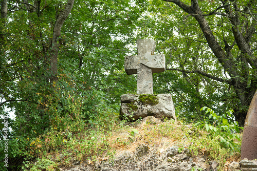 Christian cross made by stone in outdoor.