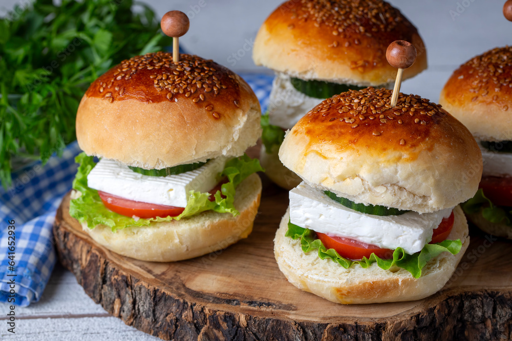 Mini sandwiches with feta cheese, tomato and cucumber. Mini sandwiches with feta cheese, tomato and cucumber.