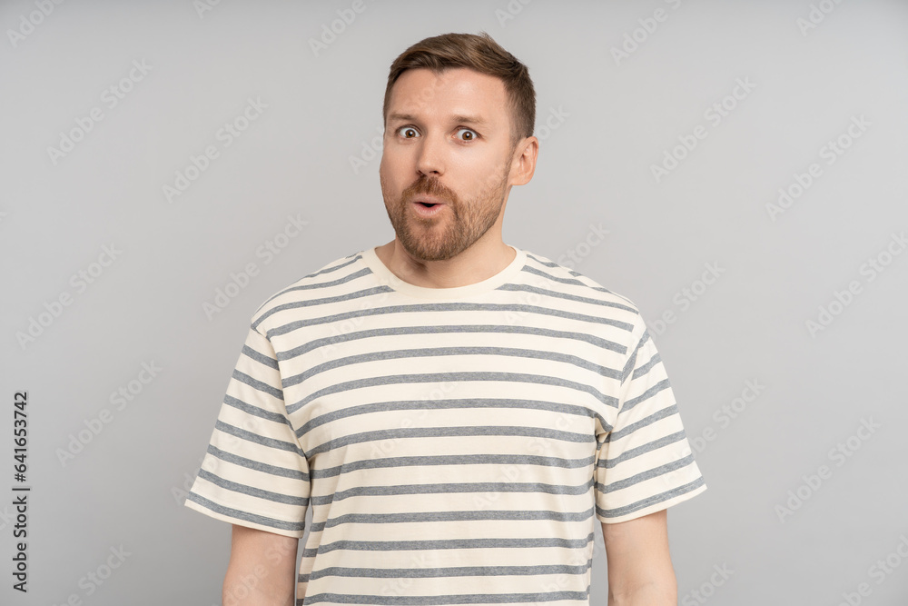Astonished man looking open mouth in amazement, omg, surprised from ad offer opportunity. Shocked middle aged caucasian male with excited expression round eyes, isolated studio background. Omg, wow Astonished man looking open mouth in amazement, omg, surprised from ad offer opportunity. Shocked middle aged caucasian male with excited expression round eyes, isolated studio background. Omg, wow