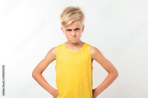 Anger European Boy In A Yellow Tank Top On White Background. Сoncept Expressing Anger, European Teenagers, Yellow Tank Tops, White Backgrounds