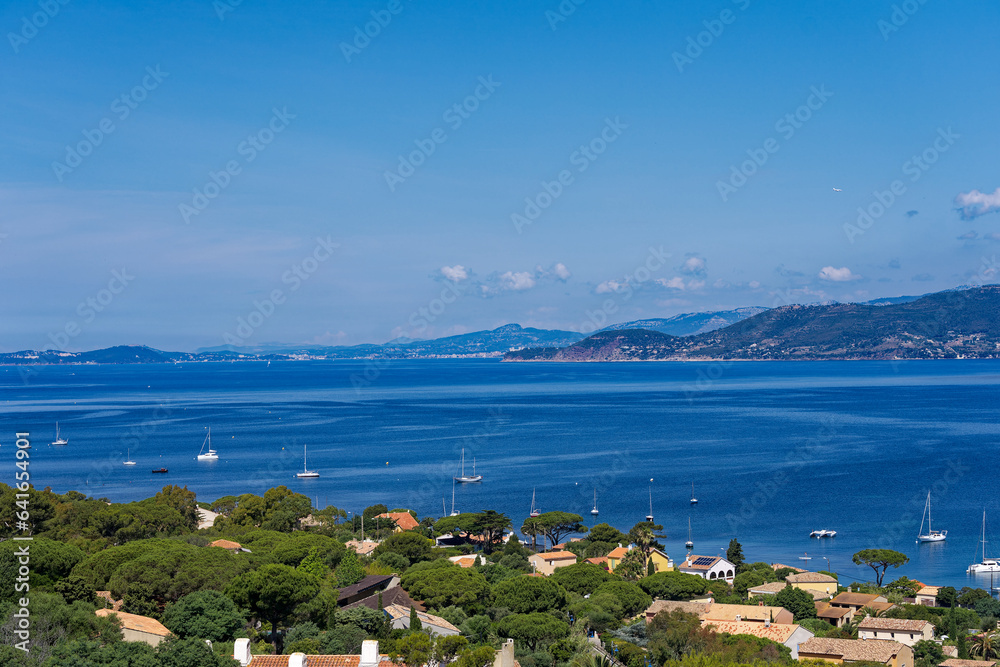 Aerial view from Giens peninsula on a sunny spring day with Mediterranean Sea and mountain panorama in the background. Photo taken June 8th, 2023, Giens, Hyères, France.
