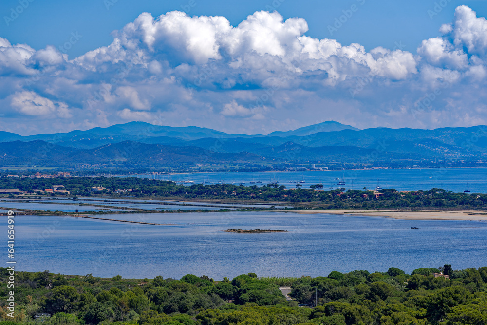 Aerial view of Giens peninsula on a sunny spring day with Mediterranean Sea, saline and beach in the background. Photo taken June 8th, 2023, Giens, France.