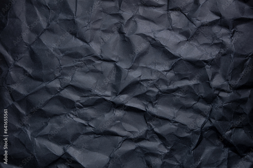 Fototapeta premium black crumpled paper background