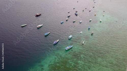 Aerial view of Gili Trawangan, West Nusa Tenggara. Panoramic showcasing boats, beach, and natural beauty.