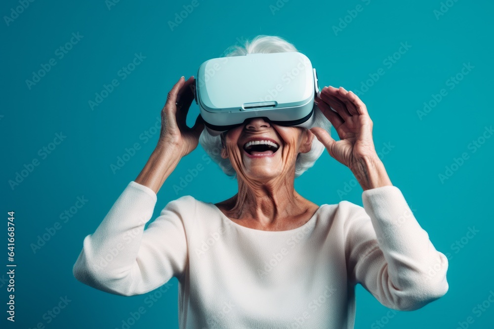 Headshot portrait photography of a tender mature woman playing with virtual reality mask against a turquoise blue background. With generative AI technology Headshot portrait photography of a tender mature woman playing with virtual reality mask against a turquoise blue background. With generative AI technology