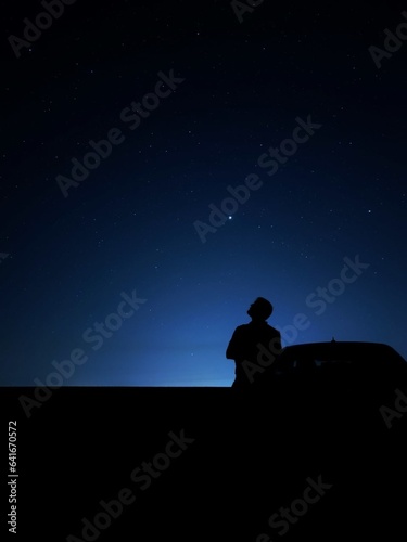 silhouette of a man sitting on a chair