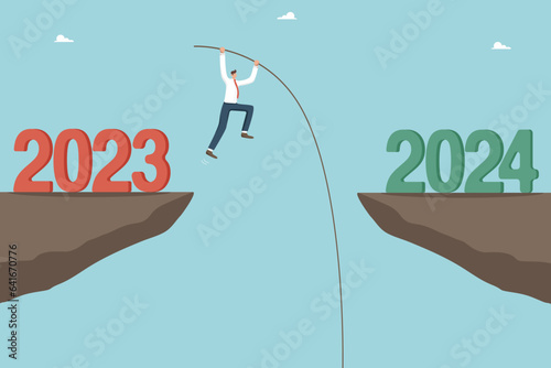 Overcoming obstacles and failures in the outgoing 2023, solving unfinished tasks in the outgoing year, motivation for success and growth in new year 2024, man with pole is jumping over cliff by 2024.